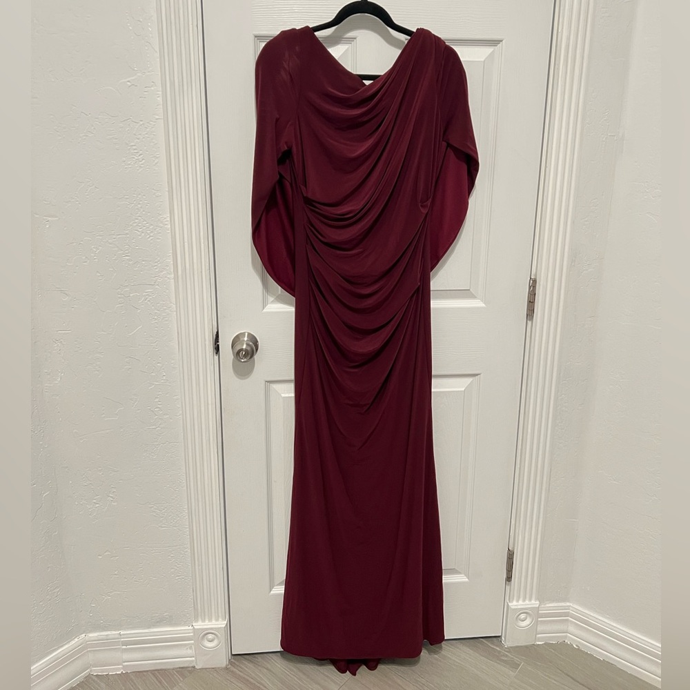 Wine Cape Long Sleeve Trumpet Gown
Betsy & Adam - Picture 5 of 7